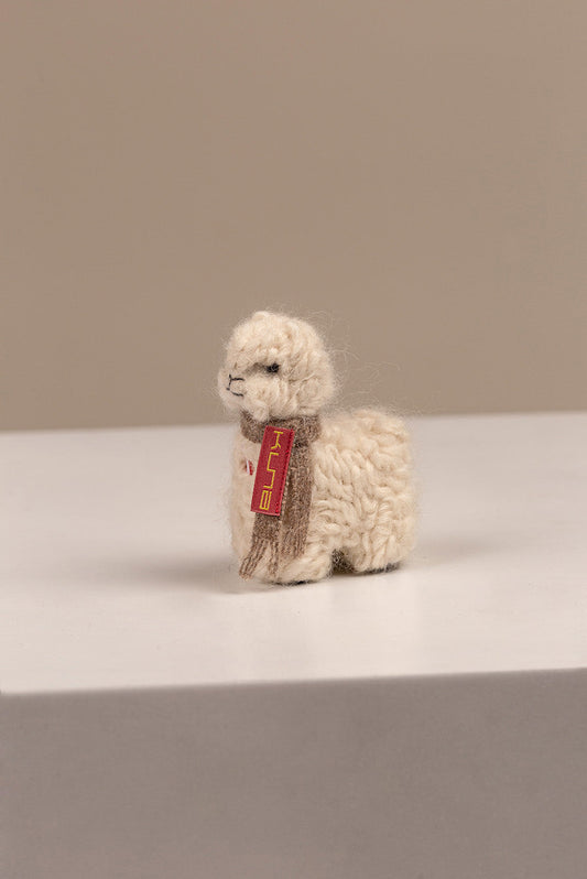 Peluche Qoni Pequeña en Baby Alpaga Couleur Ecru